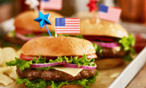 Hamburgers on a tray with festive 4th of July decorations