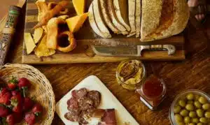 Charcuterie board with bread, spreads, cheese and meats