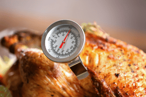 Food thermometer in a piece of meat