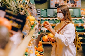 Girl with mask at grocery store