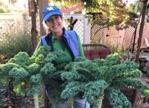 Marianne Smith Edge with kale grown during the pandemic