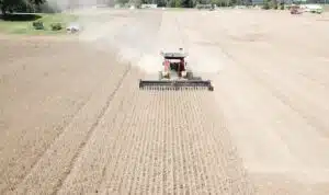 A farmer plowing a field