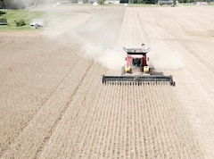 A farmer plowing a field