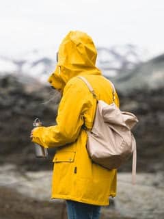 Woman wearing yellow raincoat
